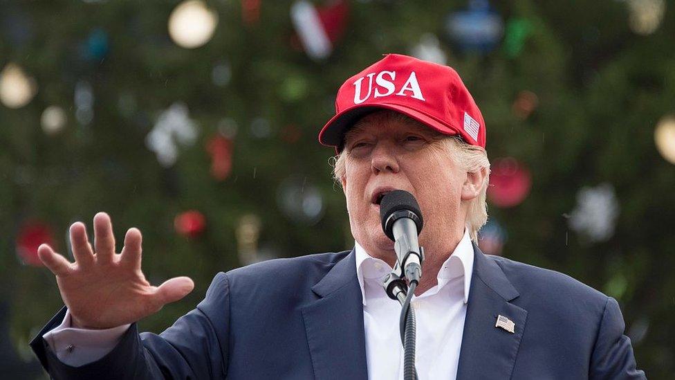 US President-elect Donald Trump speaks in Mobile, Alabama, during a 'Thank You Tour 2016' rally on December 17, 2016