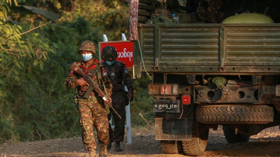 Soldiers walk near Congress compound in Nay Pyi Taw