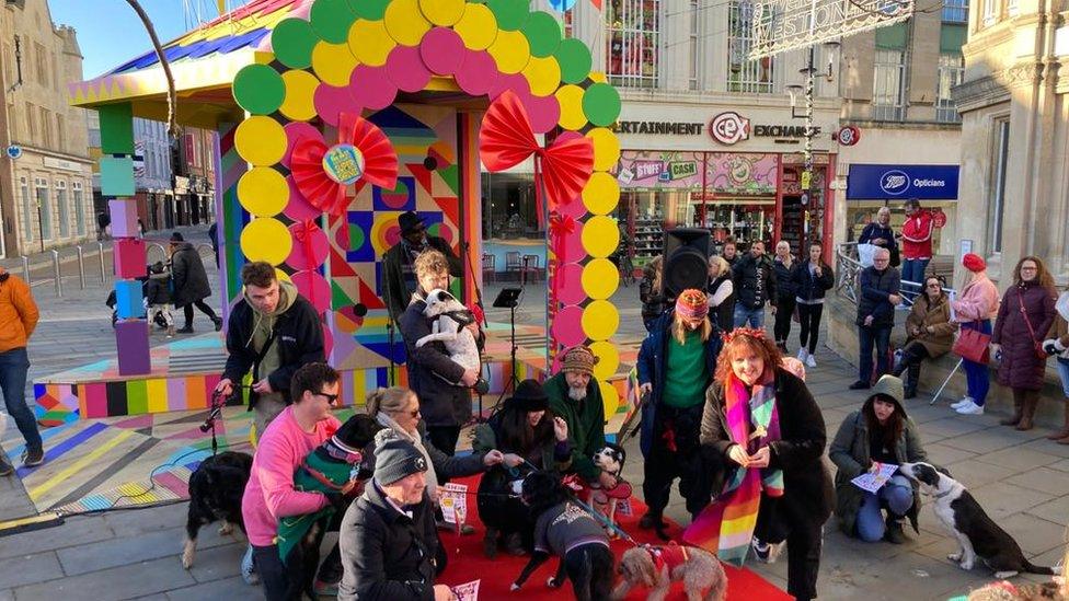 People gathered in front of the colourful bandstand in Weston-super-Mare High Street