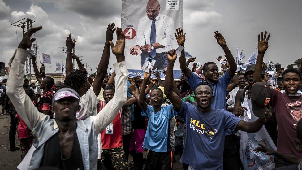 Supporters of opposition leader Martin Fayulu march and chant slogans in the streets of the Ndjili district of Kinshasa, 19 December 2018