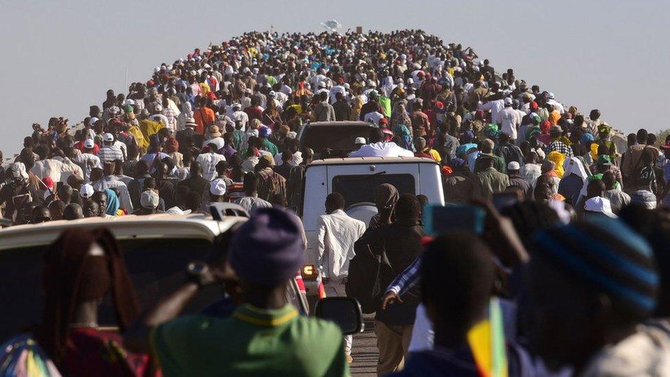 People crossing the bridge