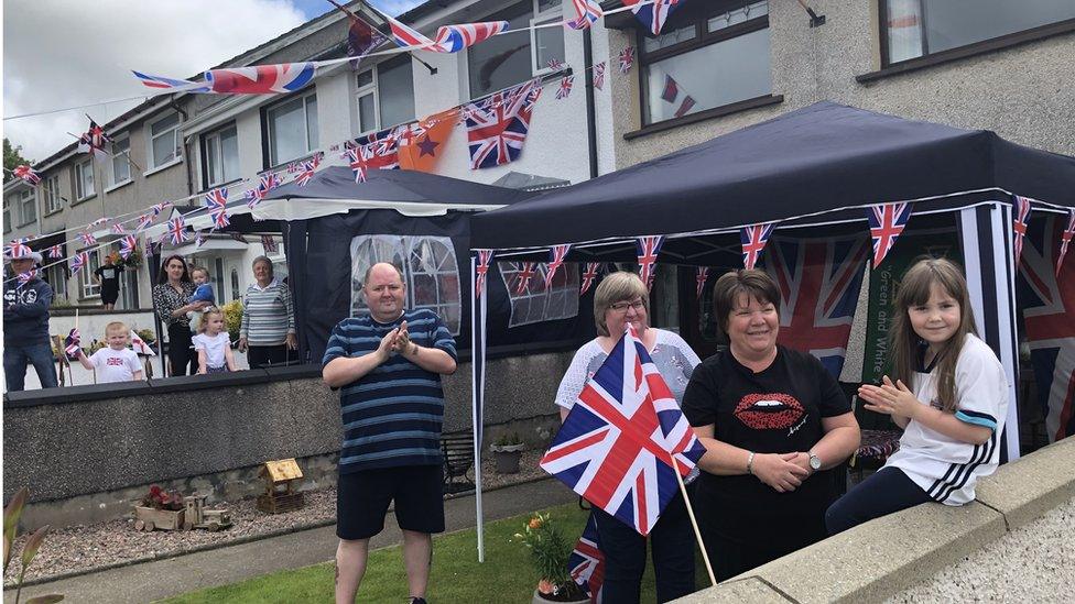 Families celebrate in their gardens in Newbuildings, County Londonderry