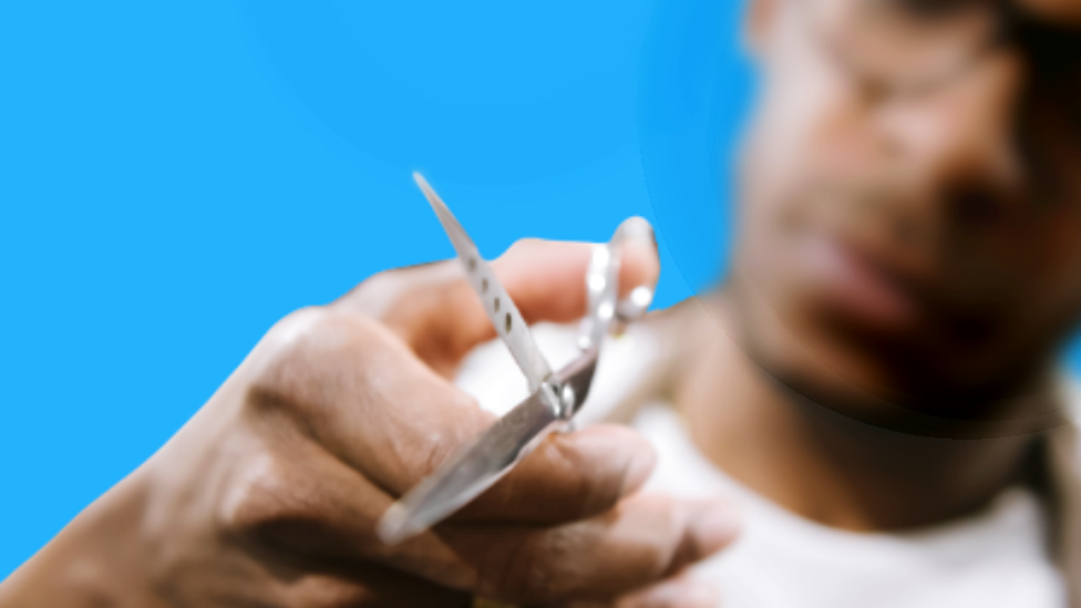 A man using scissors