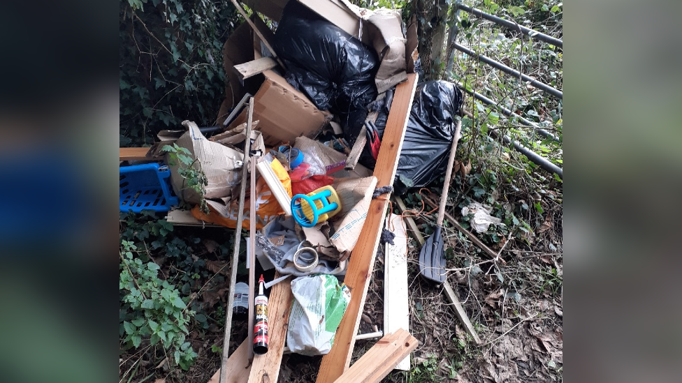 Furniture that has been fly-tipped in the woods