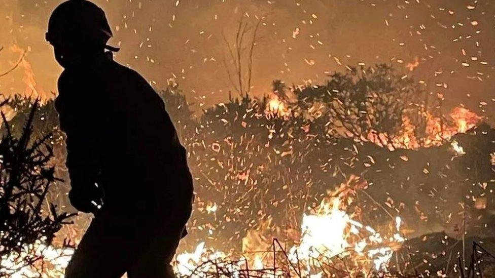 A firefighter at the scene of the blaze near Newby Bridge