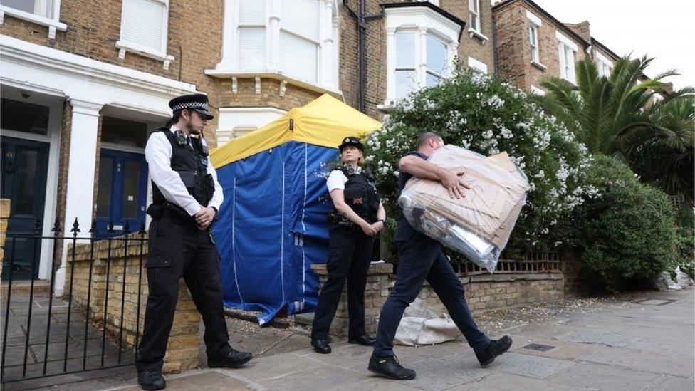 Police officers outside a house in north London