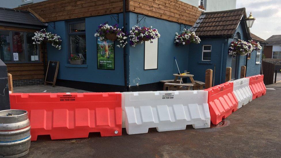 Barrier around the pub