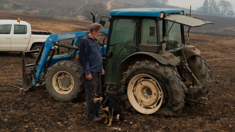 Neil in front of the broken tractor