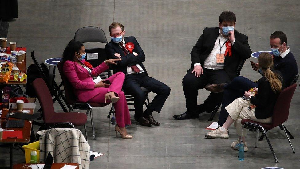 Five Labour supporters wait in the Aberdeen as ballot papers are counted