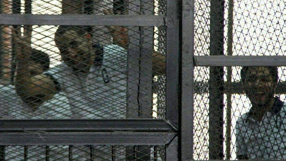 Samhi Moustafa inside a prison cage in Cairo