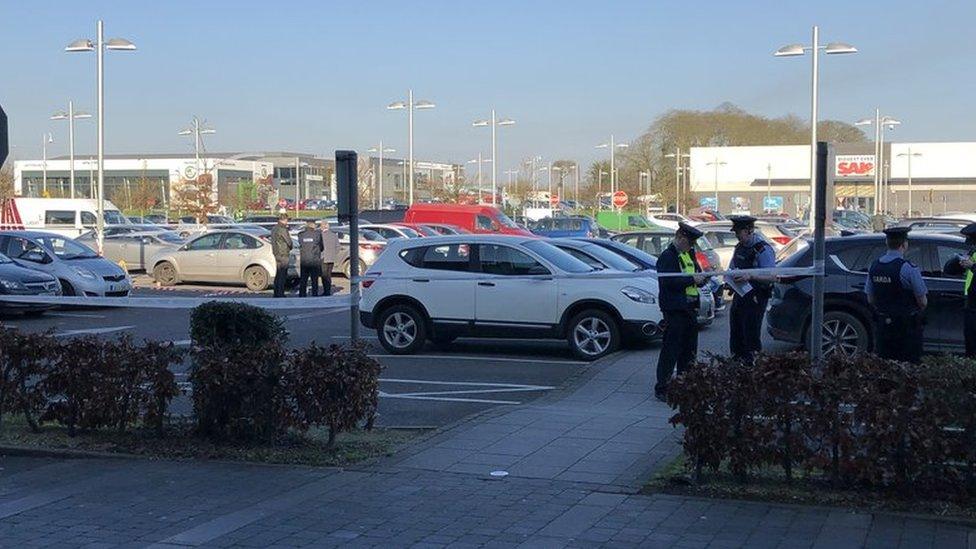 Gardaí (Irish police) at the scene of the shooting at the M1 Retail Park in Drogheda