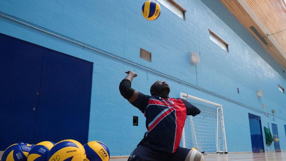 Lamin Manneh serving during a training session