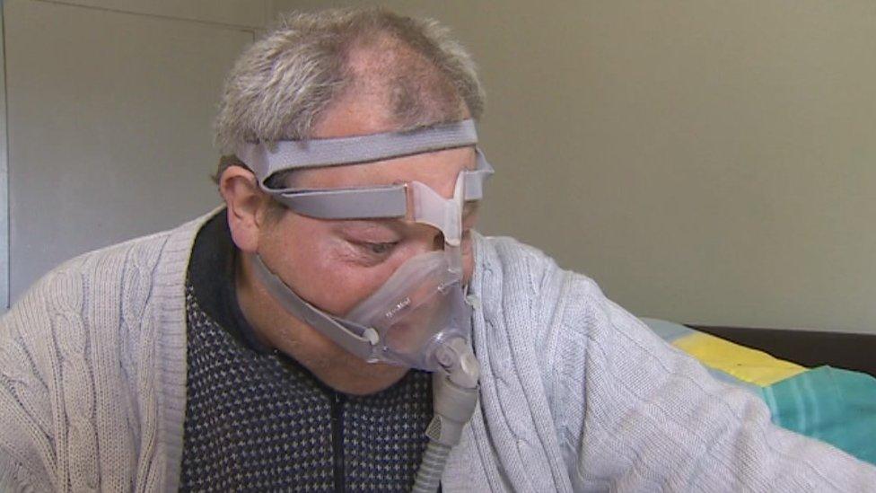 Photo of Alan McKitrick wearing breathing equipment