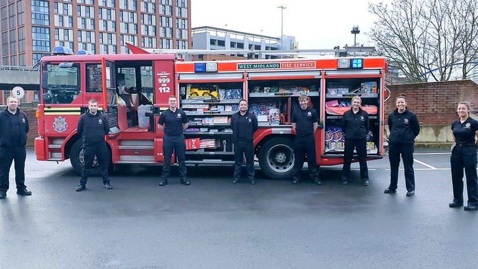 Firefighters with presents