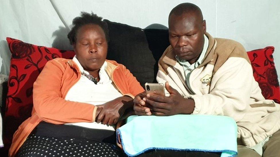 Agnes Wanjiru's sister and brother in law looking at a phone