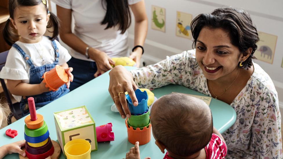 A childcare worker with children