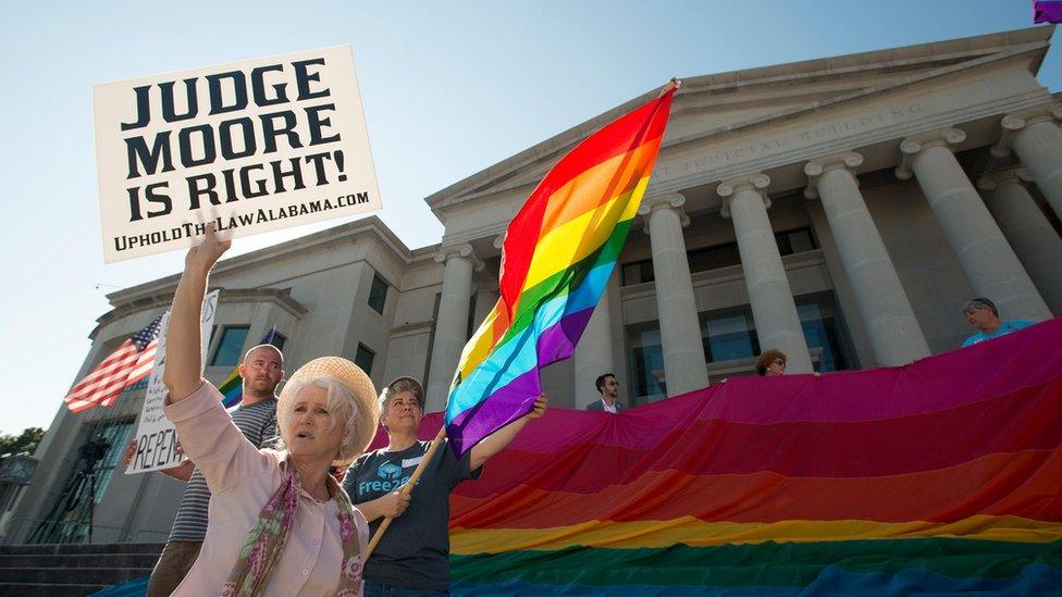 Supporter holds a sign in favour of Roy Moore during the ethics trial of the Alabama Chief Justice on 28 September