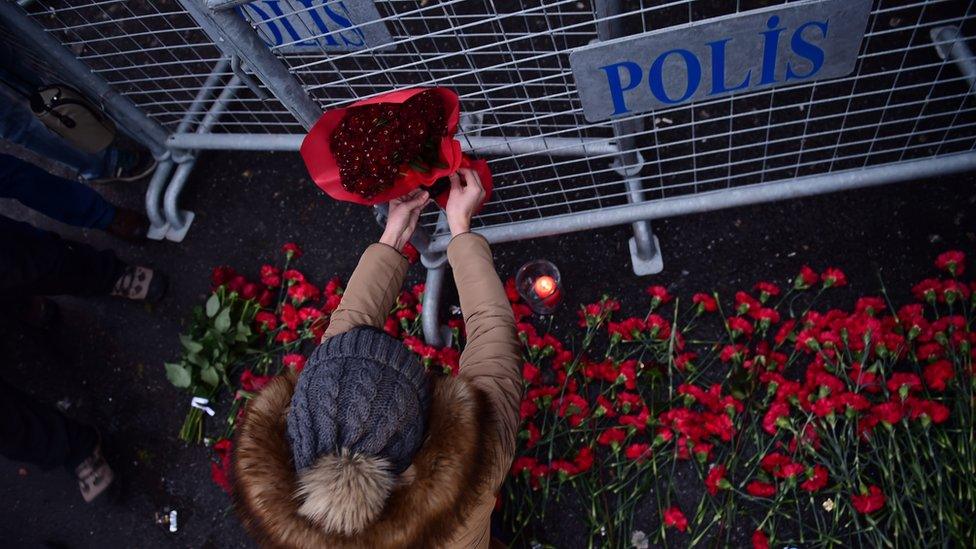 Flowers are laid outside the nightclub,