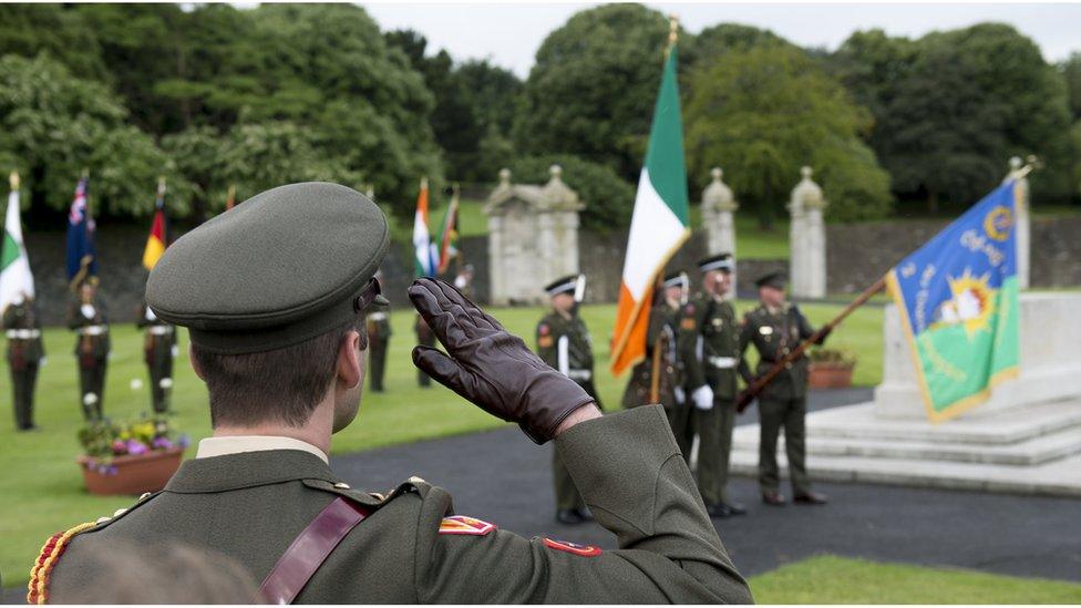 A soldier salutes those who died during the Battle of the Somme