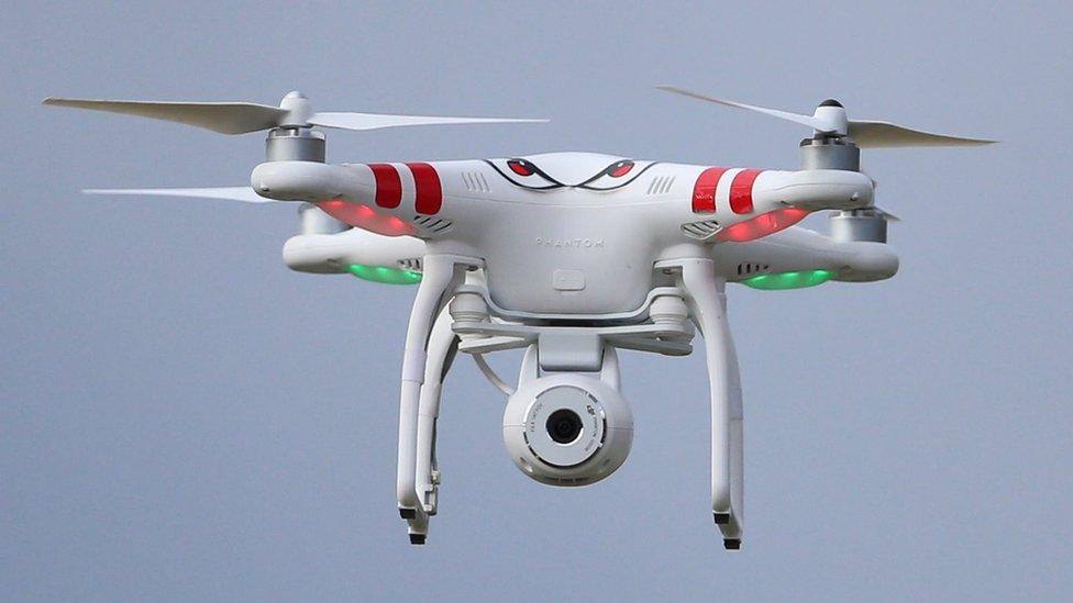 A quadcopter type drone with a camera