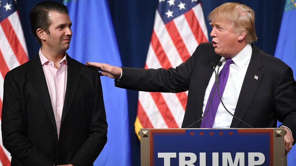 GETTY Donald Trump Jr. (L) looks on as his father, Republican presidential candidate Donald Trump, speaks at a caucus night watch party at the Treasure Island Hotel & Casino on February 23, 2016 in Las Vegas, Nevada