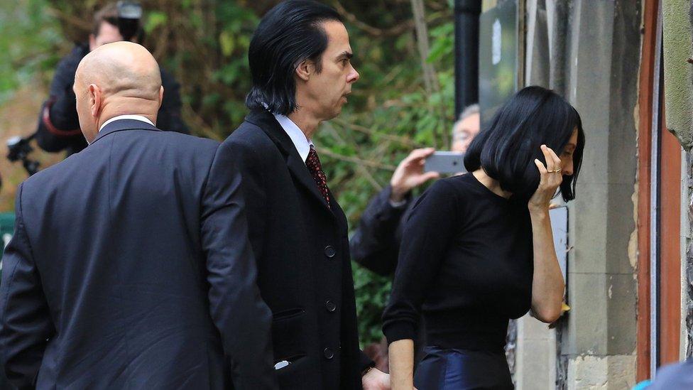 Nick Cave and his wife Susie Bick arrive at the inquest