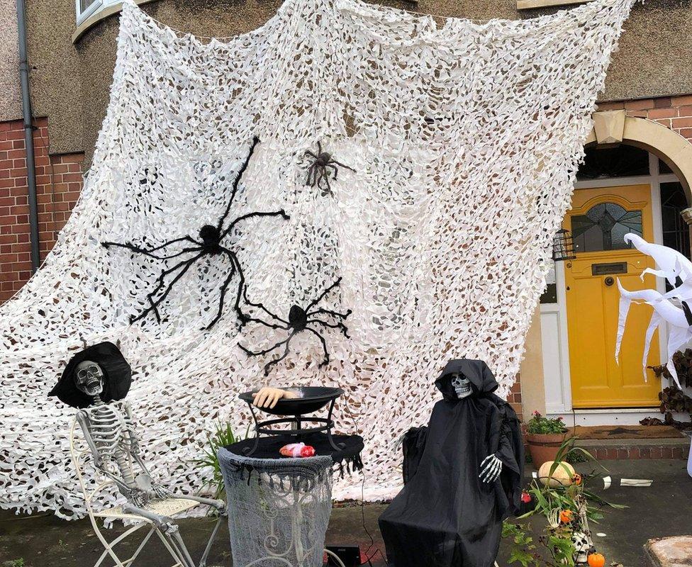 Maria Wolf's Bristol Halloween display featuring a huge spider web