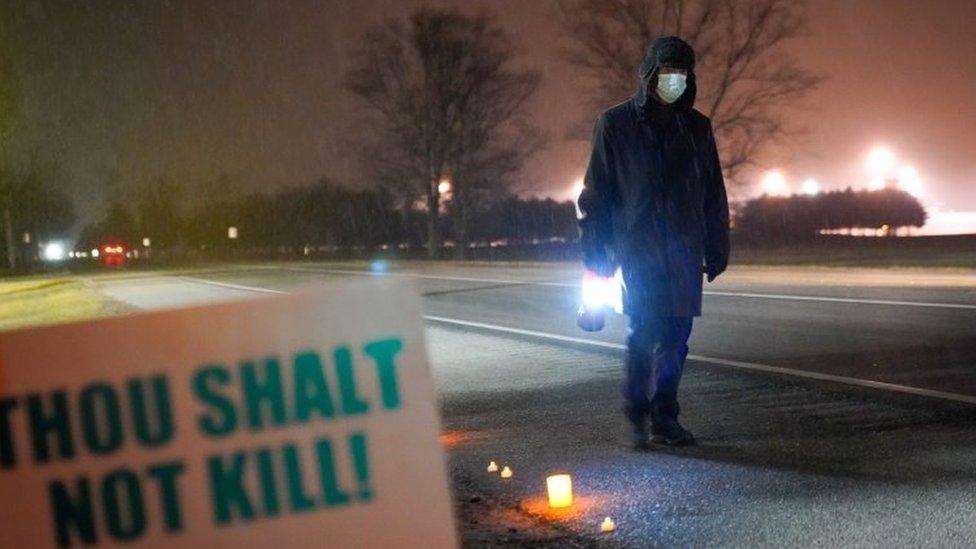 Bill Breeden, an anti-death penalty advocate, protests the execution of Dustin Higgs, outside the United States Penitentiary in Terre Haute, Indiana