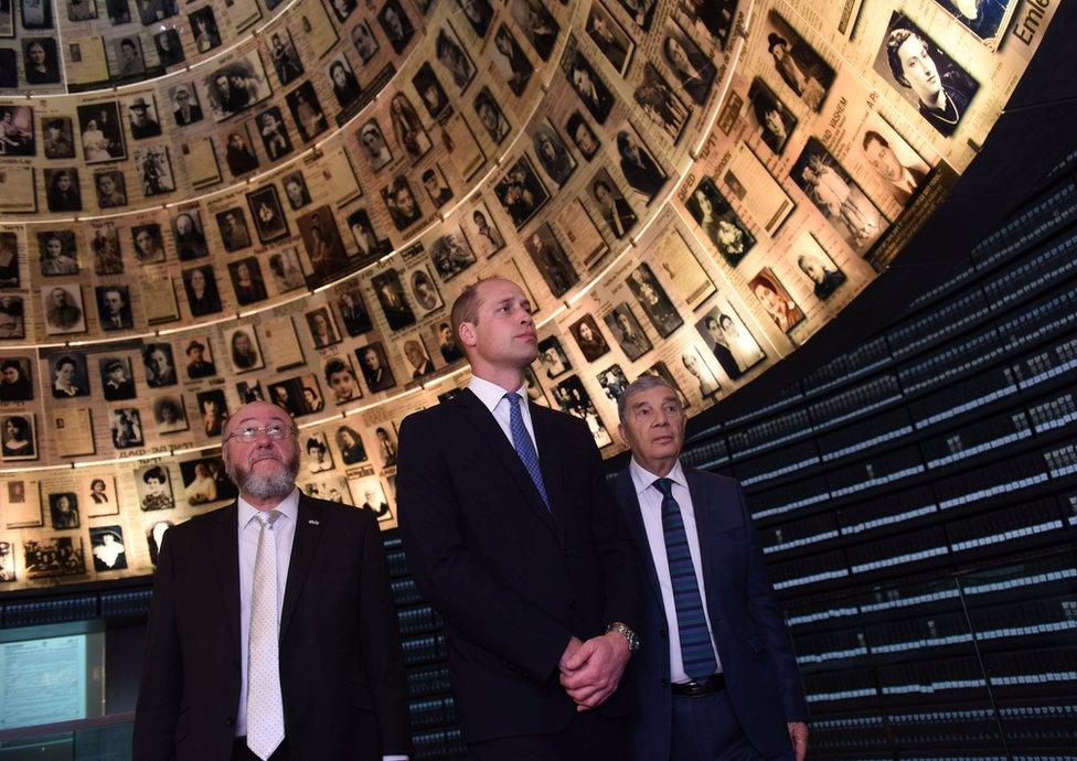 Prince William, Chairman of Yad Vashem Avner Shalev and Britain's Chief Rabbi Ephraim Mirvis visit the Hall of Names at Yad Vashem Holocaust History Museum in Jerusalem