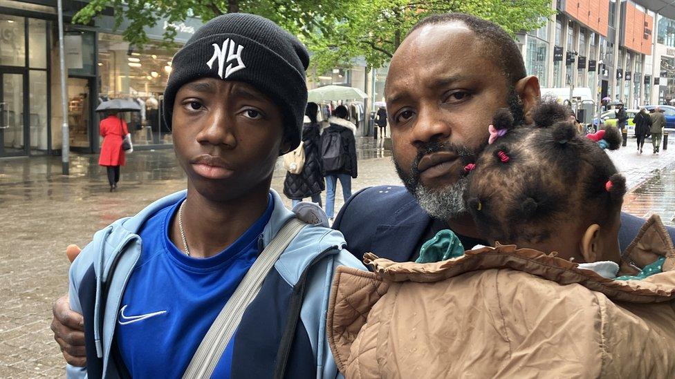 Twin brother of Victoria Olabode, Victor and her father also Victor with younger daughter Alora outside Mcr Coroners Court.