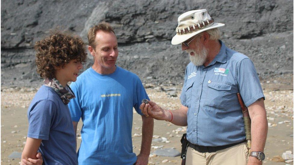 L-R: Isaac Cousins with his father Dan Cousins talking to Stuart Godman