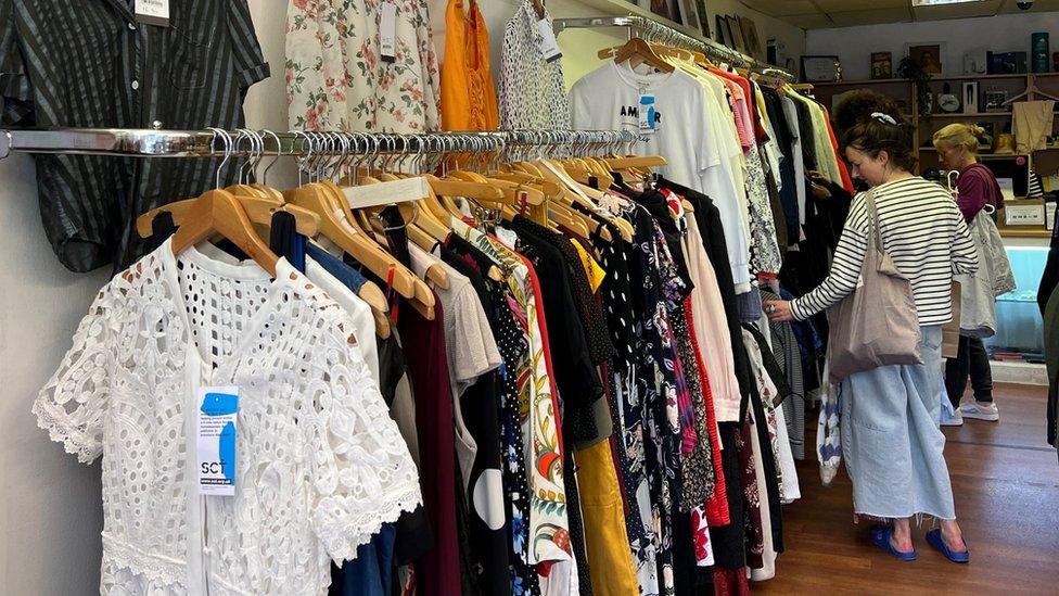 Woman shopping in a charity shop