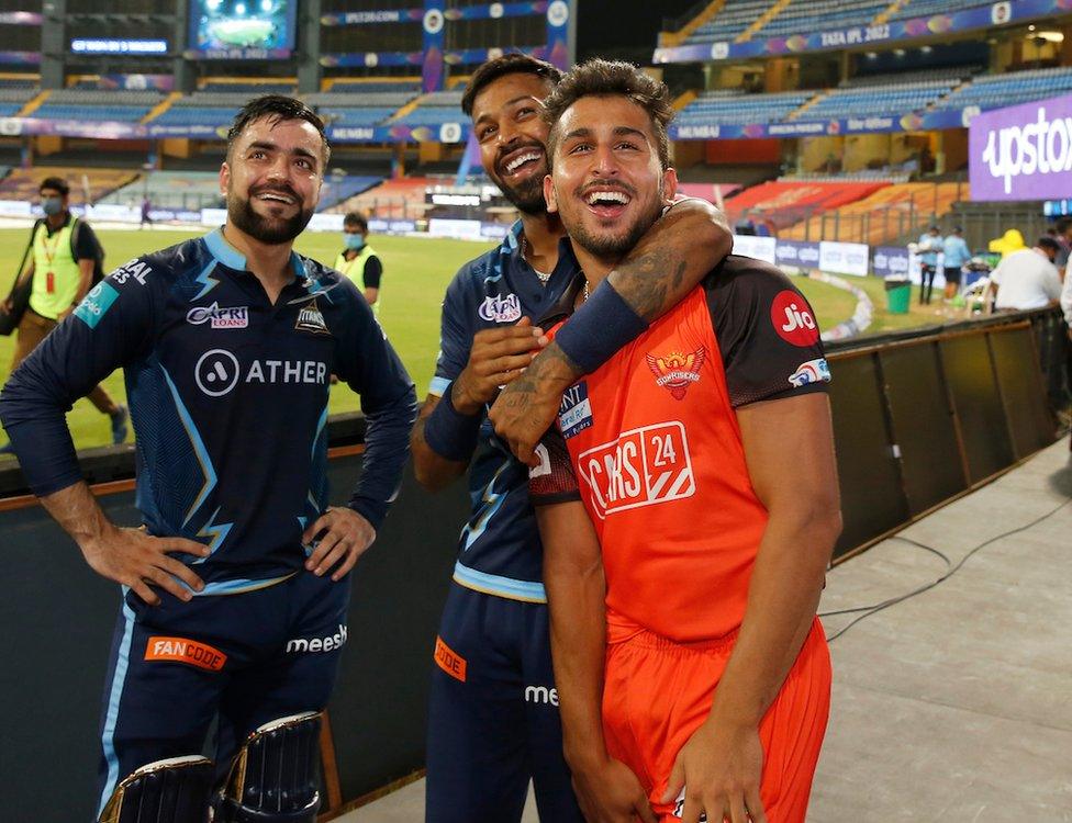 Hardik Pandya Captain of Gujarat Titans, Rashid Khan of Gujarat Titans and Umran Malik of the Sunrisers Hyderabad after match 40 of the TATA Indian Premier League 2022 (IPL season 15) between the Gujarat Titans and the Sunrisers Hyderabad held at the Wankhede stadium in Mumbai on the 27th April 2022