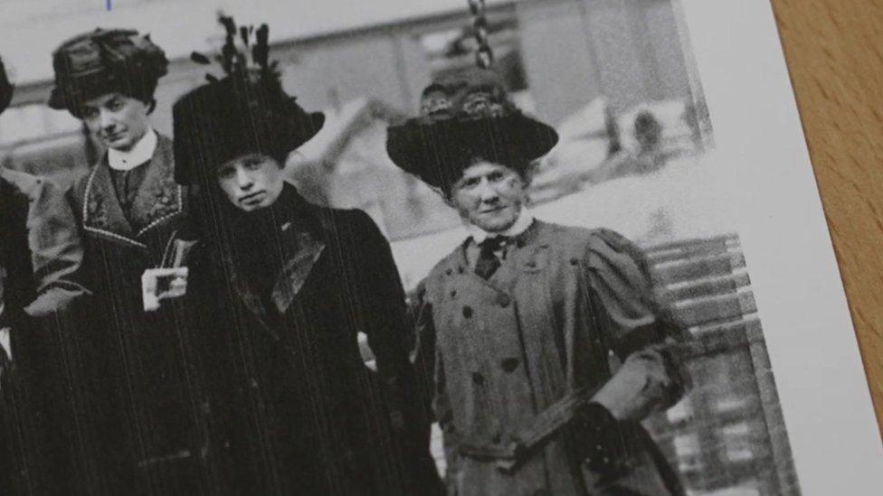 A black and white photo of a group of women