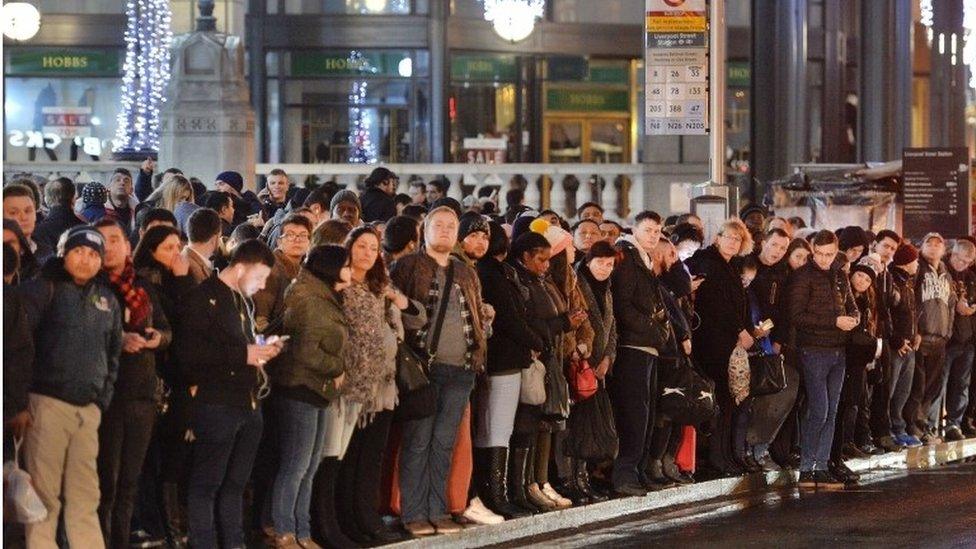 Commuters waiting for buses