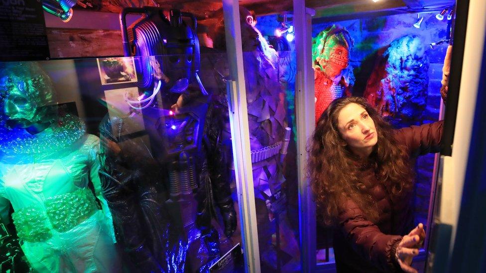 Lisa Cole alongside a Cyberman costume in the couple's cellar