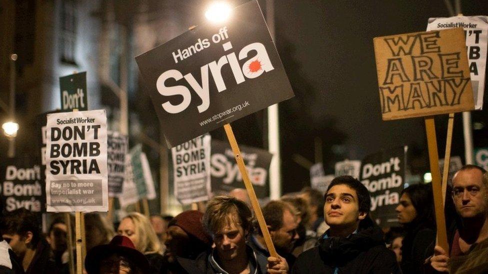 Demonstrators protest against British airstrikes against Islamic State targets in Syria outside Parliament on December 2, 2015 in London.