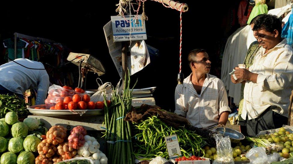 Paytm accepted here sign on a street food store in India