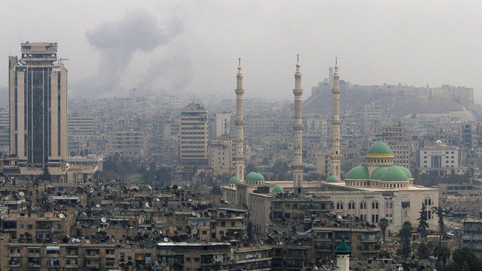 Smoke rises after strikes on Aleppo, Syria (5 December 2016)