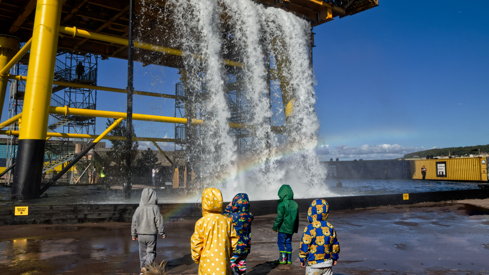 Children looking at See Monster