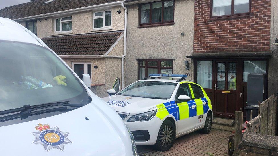 police vehicles outside house