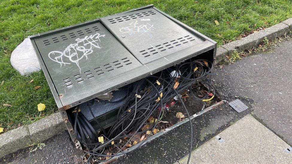 Graffiti on vandalised telecoms box