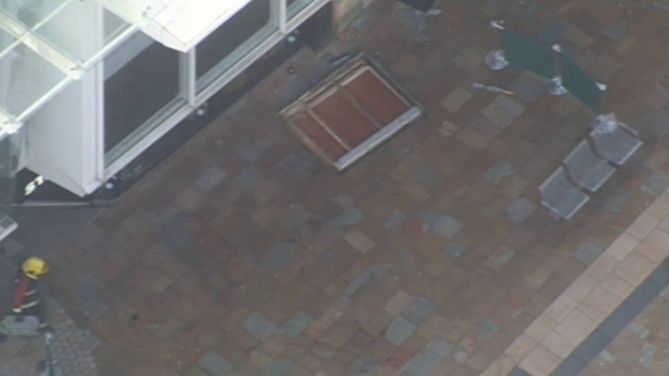 Debris on the floor outside the cafe