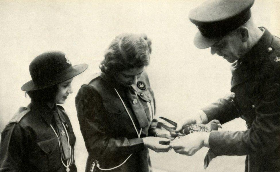 Princess Elizabeth and her younger sister Princess Margaret Rose send a message by carrier pigeon to Lady Baden-Powell on her birthday 20 February 1943