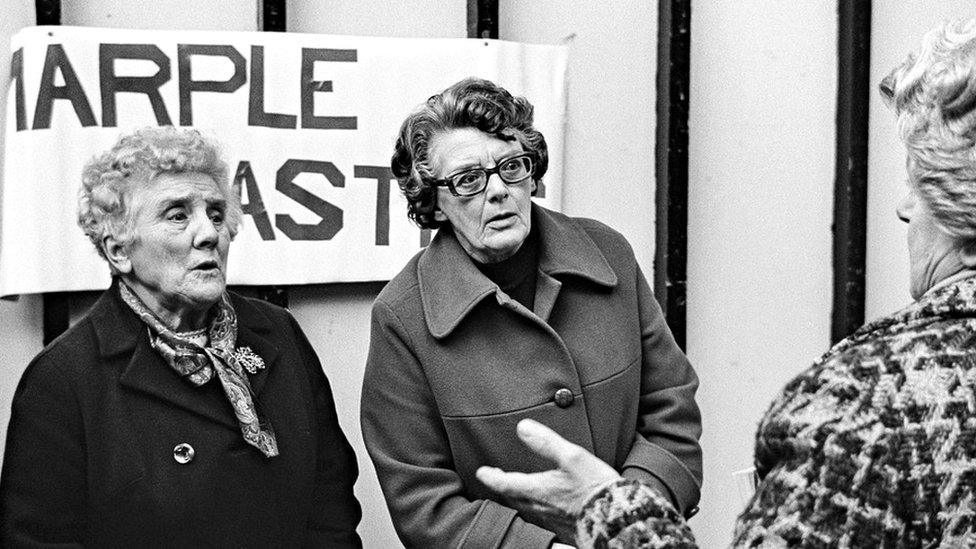 Three women engaged in lively conversation