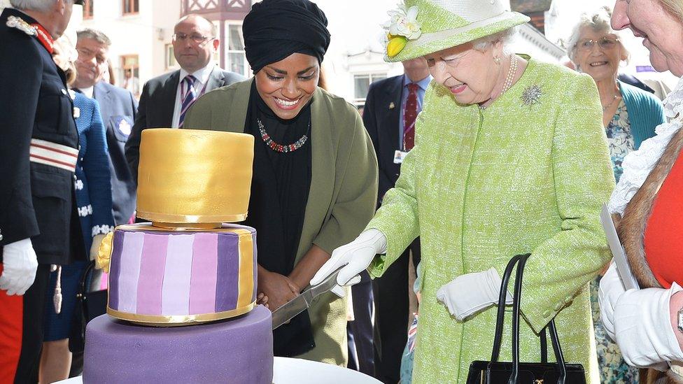 The Queen cutting her 90th birthday cake with Nadiya Hussain