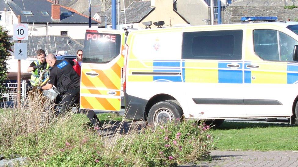 Police loading things into a van