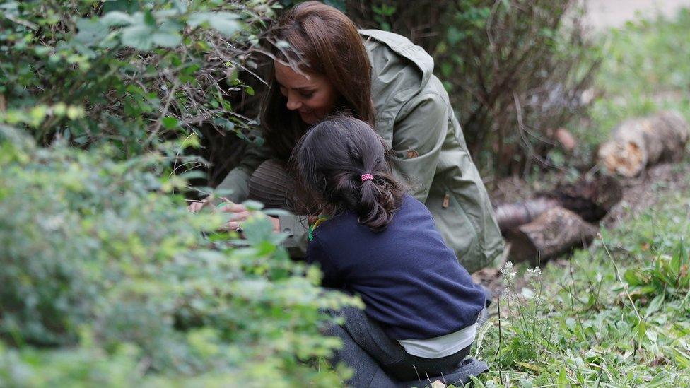 Duchess of Cambridge crouching down