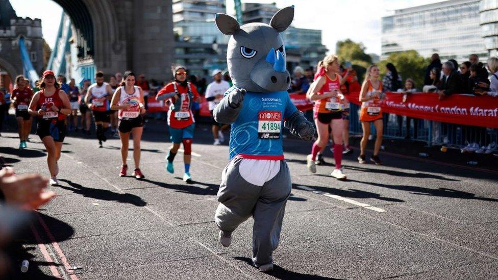 man-dressed-as-a-rhino-runs-across-london-bridge