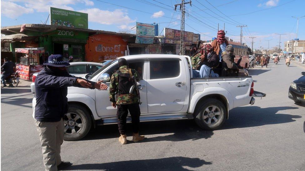 Pakistani security officials check people at a roadside checkpoint in Quetta, the provincial capital of Balochistan province, Pakistan, 17 January 2024